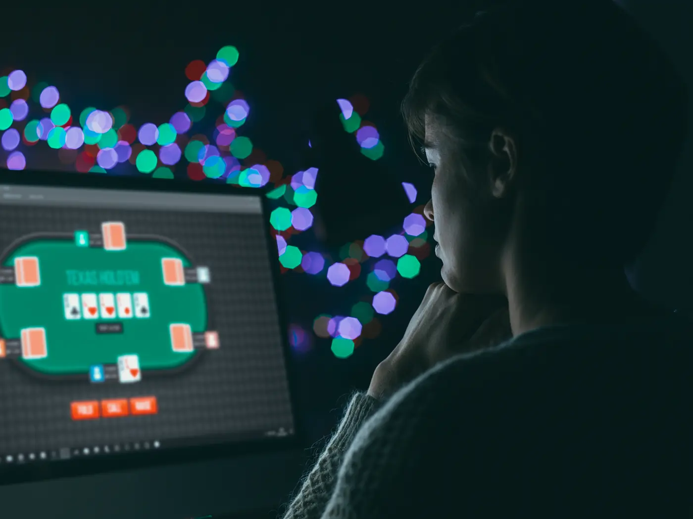 Stock photo: a person playing online poker late at night