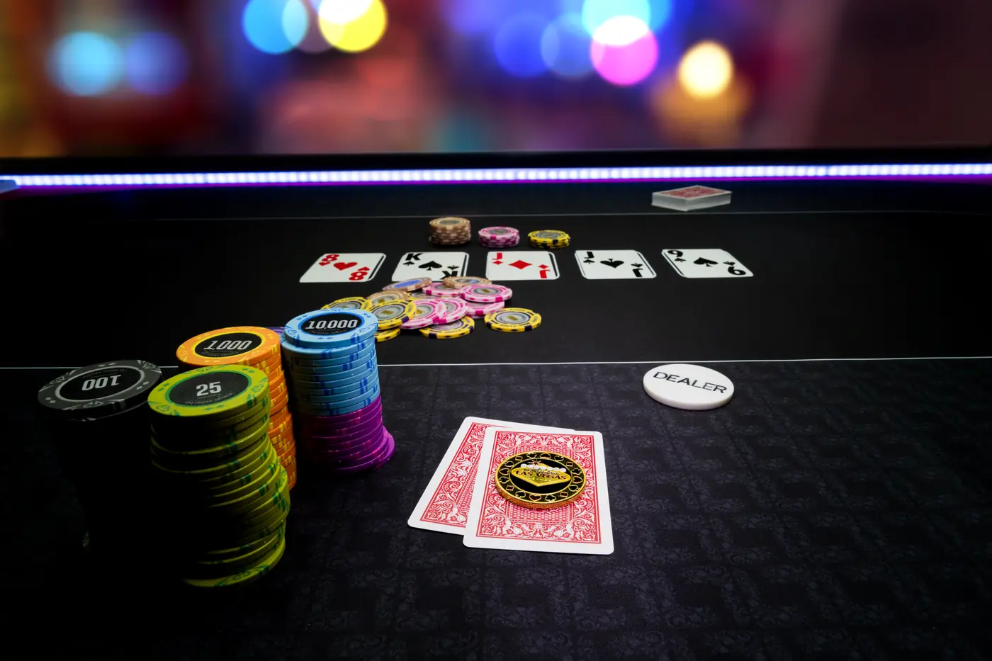 Stock photo: community cards, chip stacks and a dealer button on a poker table